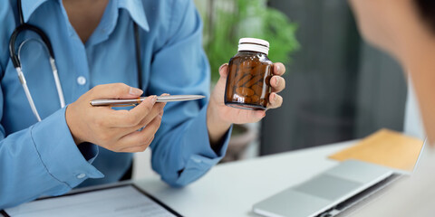 Health and Wellness. Doctor discussing medication with patient.