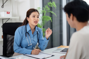 Health and Wellness. Doctor explaining health issues to a patient in a clinical setting.