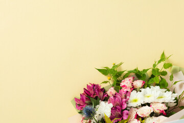 Happy Mother's day, birthday greeting card template. Beautiful mixed flower bouquet on yellow background with copy space.
