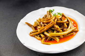 Green beans tomato sauce fresh delicious gourmet food background on the table rustic food top view...