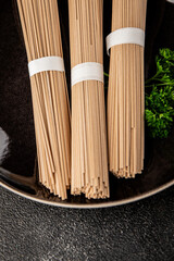 Buckwheat noodles raw soba pasta fresh dish food Asian cuisine on the table rustic food top view copy space