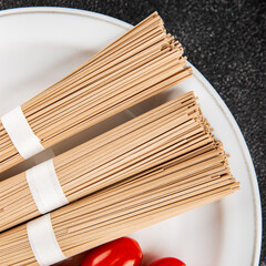 Buckwheat noodles raw soba pasta fresh dish food Asian cuisine on the table rustic food top view copy space