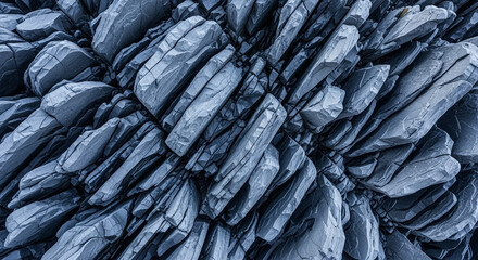 Obraz premium Textured dark blue gray basalt columnar rock formation natural abstract pattern