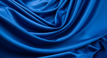 Fototapeta premium Vibrant blue satin fabric with elegant flowing drapes