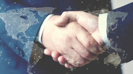Double exposure of handshake with digital world map shows virtual partnership and international cooperation in business