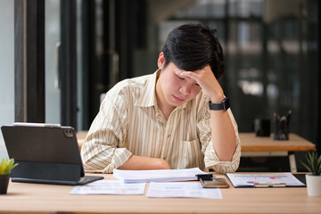Exhausted employee appearing mentally drained, illustrating pressure, stress, or decision fatigue.