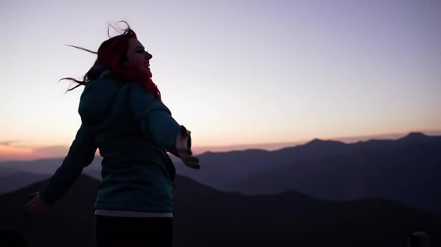Mountain Top Freedom: Woman Embracing the Sunset