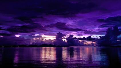 Dramatic purple sunset over tranquil water