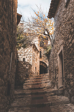 street view in the old town of eza village in cote d'azul, france, on a quiet sunny day. detail of a staircase