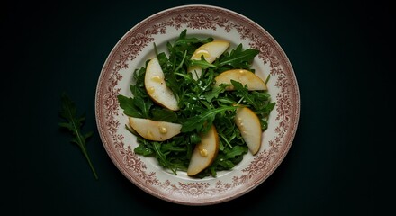 Overhead Shot of a Pear and Arugula Salad on a Decorative Plate