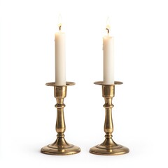 Two brass candle holders with lit white candles