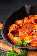 Butter chicken curry tomato sauce poultry meat dish turkey fresh tasty gourmet food background on the table rustic food top view copy space