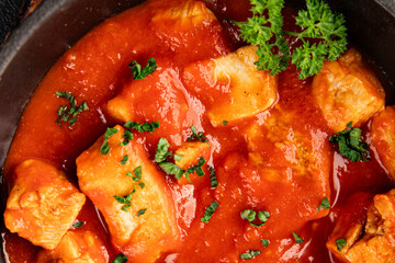 Butter chicken curry tomato sauce poultry meat dish turkey fresh tasty gourmet food background on the table rustic food top view copy space