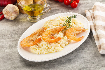 Italian risotto with prawn served thyme