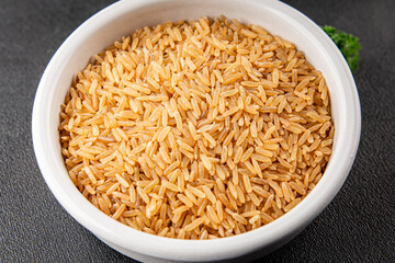 Brown rice cereal whole grain healthy product superfood fresh tasty food background on the table rustic food top view copy space
