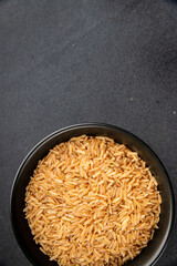 Brown rice cereal whole grain healthy product superfood fresh tasty food background on the table rustic food top view copy space