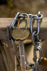 An iron lock on a chain as a symbol of love.