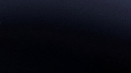 A perfectly uniform, solid black background, offering a blank canvas for various design and presentation needs.