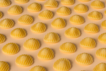 Background pasta , high-resolution . Top view of isolated a raw Italian durum wheat orecchiette...