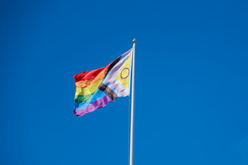 A Pride Flag against Clear Blue Sky