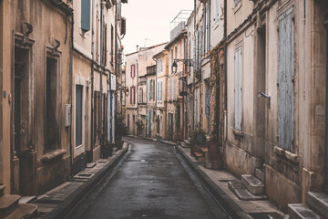 narrow street in the old town of arles, southern france
