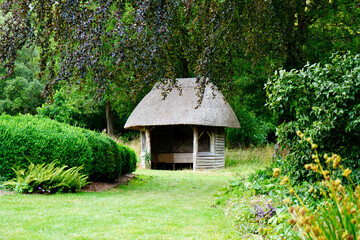 Garden seating hut surrounded by grass