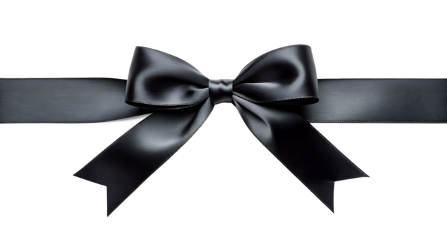 Elegant black satin ribbon bow with a textured finish isolated on a dark background suggesting gifts celebrations or memorial ceremonies.