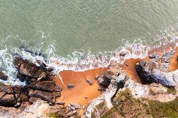Beautiful ocean landscape from a drone. View of the ocean, rocks and sand.