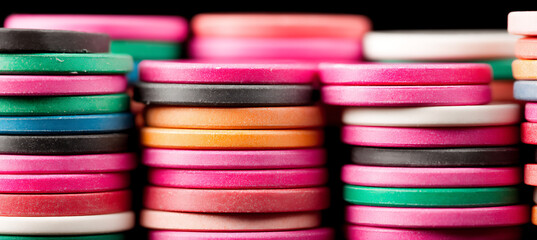 close-up colorful casino chips stacks.
