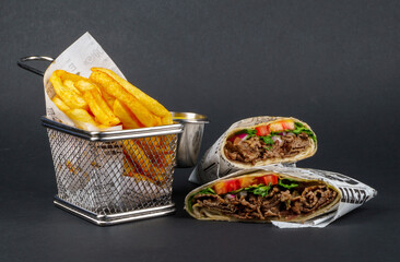 Delicious Beef Wrap Shawarma with Fresh Vegetables and French Fries