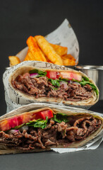 Delicious Beef Wrap Shawarma with Fresh Vegetables and French Fries,closeup