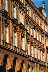 A close-up perspective showcases the intricate details of a historical building facade, focusing on...