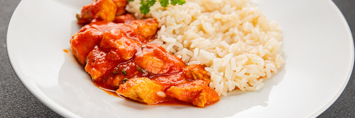 Rice butter chicken curry chicken tikka masala spicy meat in a bowl on the table fresh tasty gourmet food background on rustic food top view copy space
