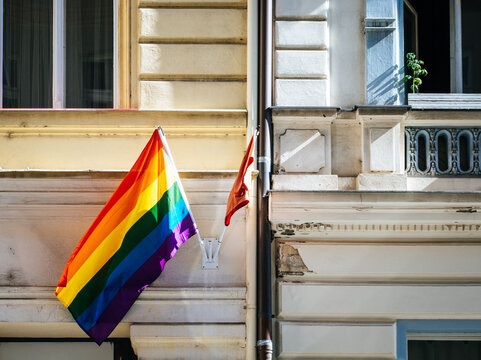 Rainbow Flag on Urban Building Facade