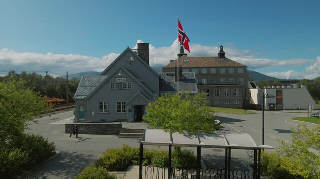 Historic Oppdal train station with Norwegian flag