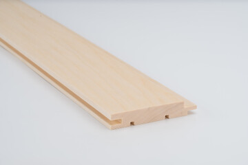 Light wood frame profile with detailed grooving, shown on white background. Precision-cut construction component for joinery or trim work..