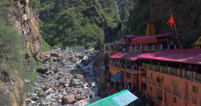Aerial approach toward sacred Hindu temple along the Yamuna River at Yamunotri Dham in the Uttarakhand Himalayas, important Char Dham pilgrimage site