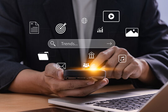 Digital marketing concept. businessman tapping mobile screen to access online data trends and virtual applications, representing internet search, innovation, business planning and communication tools.