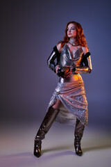Elegant woman embodies castle core fashion with a modern twist in a striking metallic ensemble