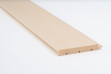 Light wood panel with precision grooves and stepped edges, shown on white background. Ideal for wall cladding, flooring, or trim installation..