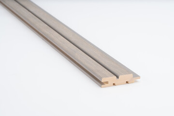 Gray-toned wooden slat profile with precise parallel grooves, shown on white background. Ideal for acoustic paneling or decorative wall installation..