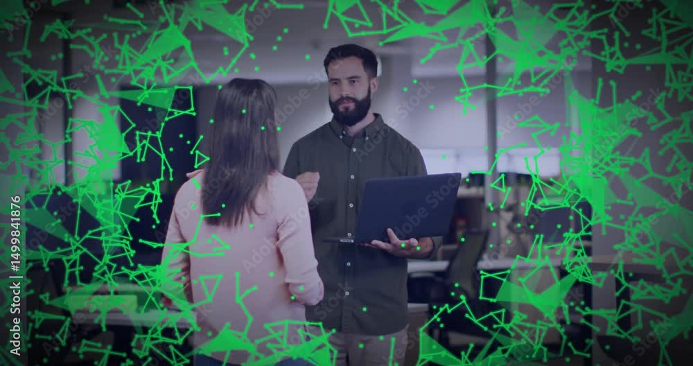 Poster woman walking up to peer with laptop in office tech talk data shapes appearing intensifying fading