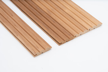 Brown arched wood panels with tongue-and-groove connections, placed on a white background. Designed for acoustic, decorative, or wall panel applications..