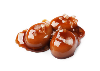 Tasty sweet candies, salt and caramel sauce isolated on white
