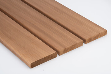 Three brown wooden boards with smooth surfaces and rounded edges, placed side by side on a white background, highlighting wood grain and finish..