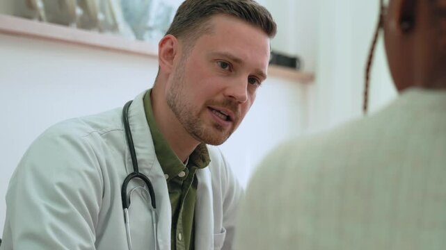 Healthcare provider carefully examining patient records, attentively listening, offering personalized medical guidance with empathy in modern clinical environment