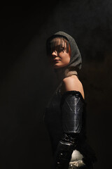 Fototapeta premium Elegant woman in knightcore fashion exuding grace within an ancient castle setting