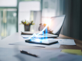 2026 A professionally lit office desk with paper documents and a glowing arrow illustration emerging from a tablet screen, symbolizing digital transformation and revenue growth.