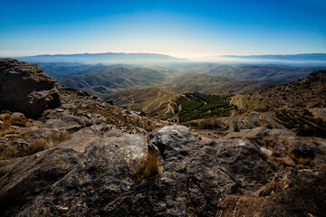 Fototapeta premium Alto de Velefique. A rocky peak with a clear blue sky.