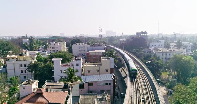 An aerial view of namma metro train moving on railroad track in bangalore,india, railway network
